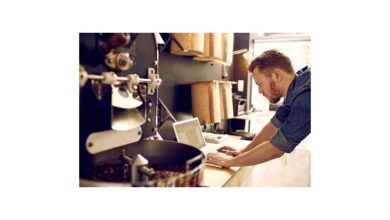 Small business owner using laptop for payroll in the UK