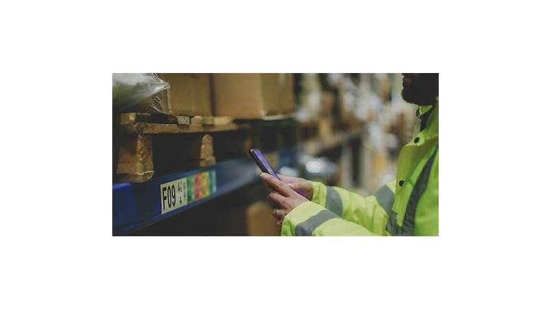 A person looking at various business software options on a tablet, representing the decision-making process for accounting software in the UK.