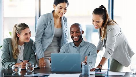 A diverse team collaborating on software development with a subtle UK map overlay in the background, illustrating the nationwide impact of UK software development companies.